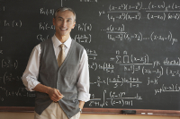 You can be a teacher (or be taught by one) at All About The Knowledge. A teacher smiling in front of a chalkboard with hundreds of equations artfully written behind him.