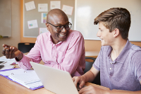 You can be a tutor (or hire a tutor) at All About The Knowledge. A tutor helping a student.